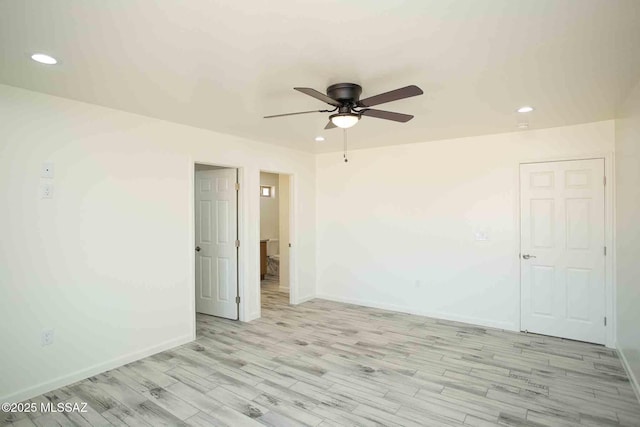 unfurnished room with a ceiling fan, recessed lighting, baseboards, and light wood finished floors