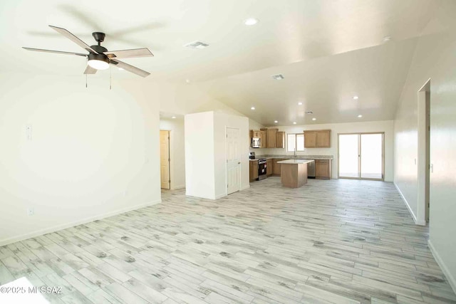 unfurnished living room with lofted ceiling, light wood-style flooring, recessed lighting, visible vents, and baseboards