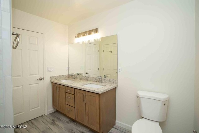 washroom featuring hookup for a washing machine, recessed lighting, hookup for an electric dryer, wood finished floors, and laundry area