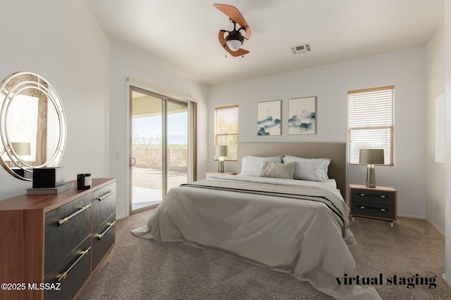 bedroom featuring baseboards, carpet flooring, visible vents, and access to exterior