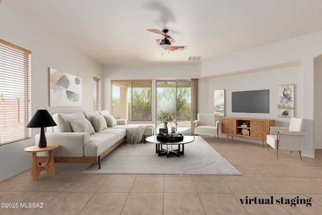 living room with light tile patterned flooring, ceiling fan, and visible vents
