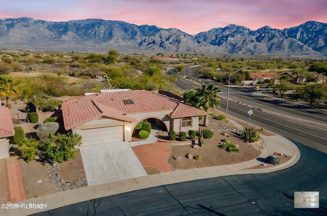 drone / aerial view featuring a mountain view