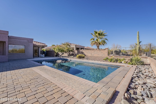 view of pool with a fenced in pool, a patio area, and a fenced backyard