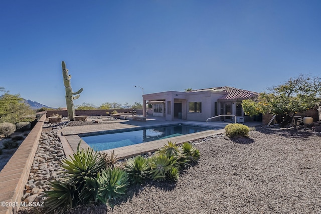 outdoor pool featuring a patio