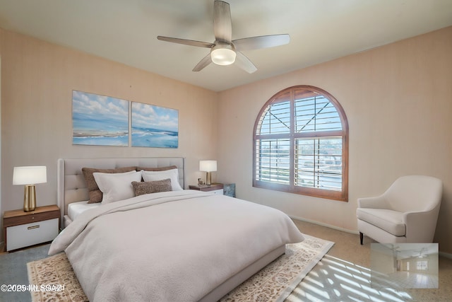 bedroom featuring carpet floors, ceiling fan, and baseboards