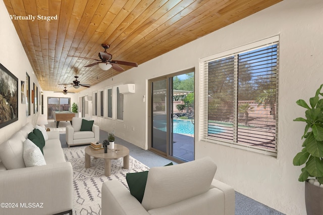 living area with wooden ceiling, a wall mounted air conditioner, and a textured wall