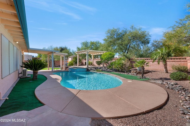 view of swimming pool featuring a patio area, a fenced backyard, a pool with connected hot tub, and a pergola