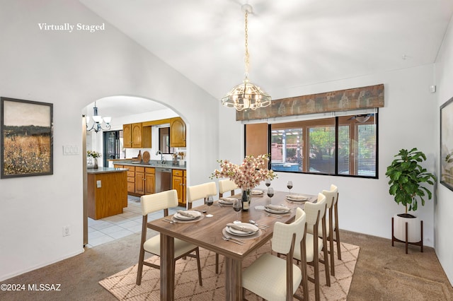 dining space featuring arched walkways, light colored carpet, and a notable chandelier