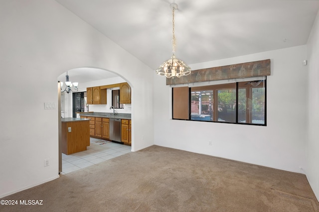 interior space featuring arched walkways, vaulted ceiling, a notable chandelier, and light colored carpet