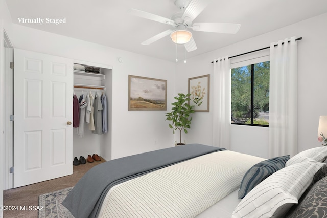 bedroom with carpet floors, a closet, and a ceiling fan