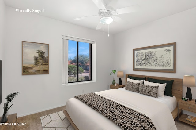 bedroom featuring carpet, ceiling fan, and baseboards