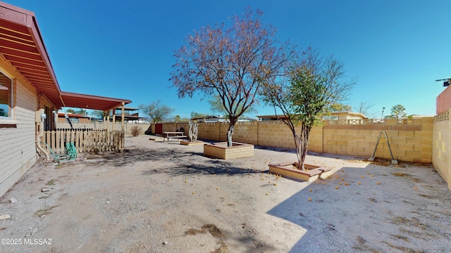 view of yard with a patio area and a fenced backyard