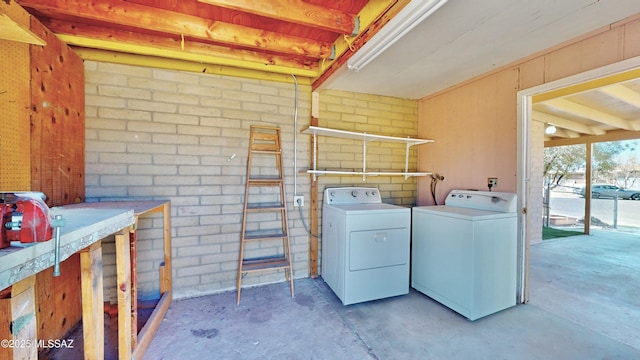 washroom with laundry area and washing machine and dryer