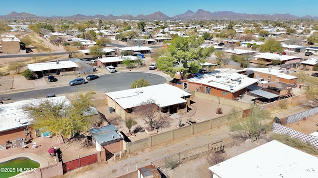 drone / aerial view featuring a residential view and a mountain view