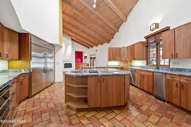 kitchen featuring wood ceiling, appliances with stainless steel finishes, dark stone countertops, high vaulted ceiling, and open shelves