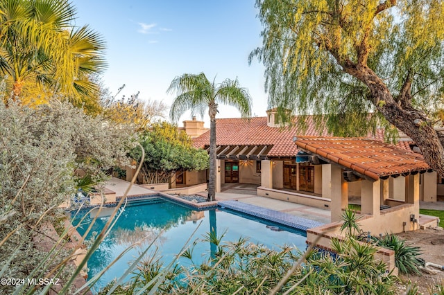 outdoor pool featuring a patio area