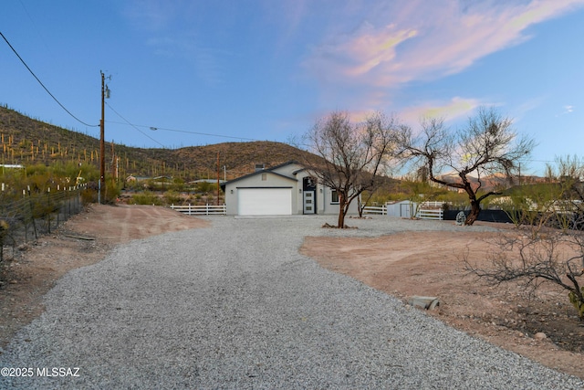 view of front of home featuring fence