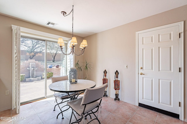 dining space featuring visible vents, a notable chandelier, baseboards, and light tile patterned flooring