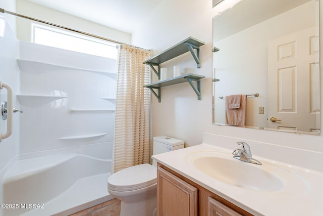 bathroom with a shower with curtain, tile patterned flooring, vanity, and toilet