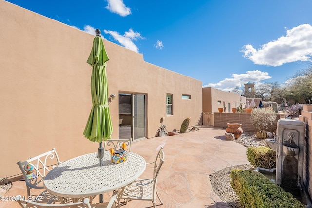 view of patio / terrace featuring fence