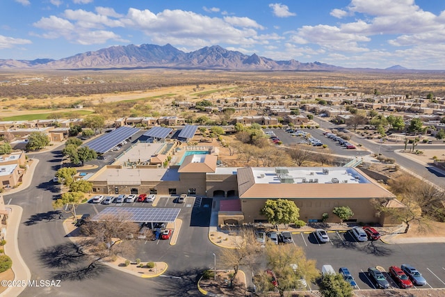 birds eye view of property with a mountain view