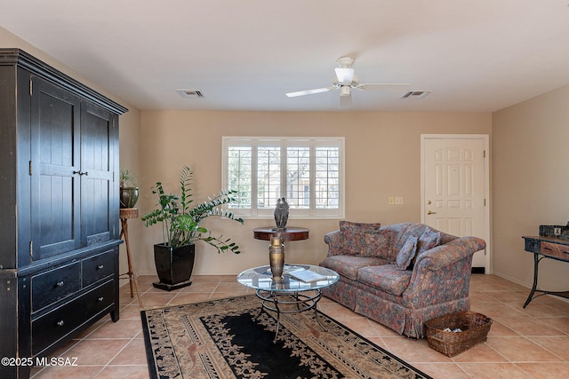 living area with light tile patterned floors, visible vents, and a ceiling fan