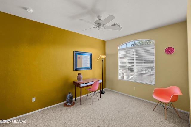 interior space with carpet floors, baseboards, and a ceiling fan