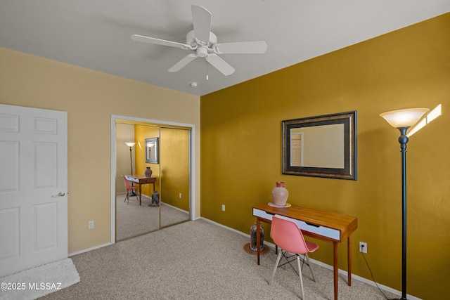 office area featuring ceiling fan, carpet floors, and baseboards