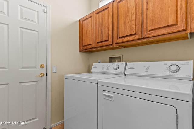 laundry area with cabinet space and washing machine and clothes dryer