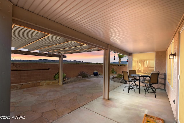 view of patio / terrace with outdoor dining space, a fenced backyard, and a pergola