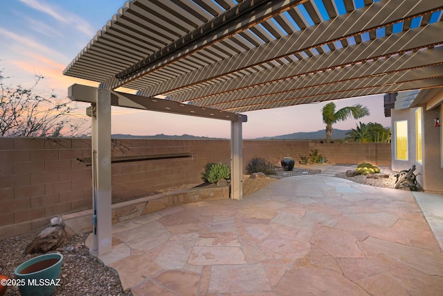 view of patio featuring a fenced backyard and a pergola