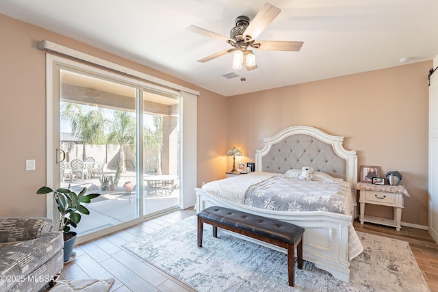 bedroom with access to exterior, visible vents, a ceiling fan, and wood finished floors