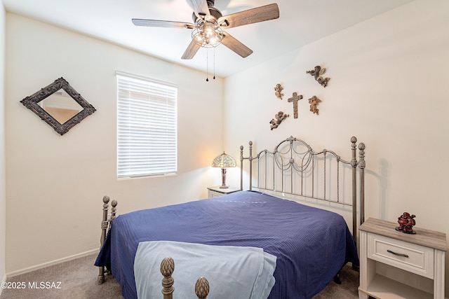 bedroom featuring baseboards, a ceiling fan, and carpet flooring