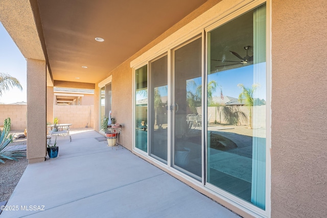 view of patio featuring fence