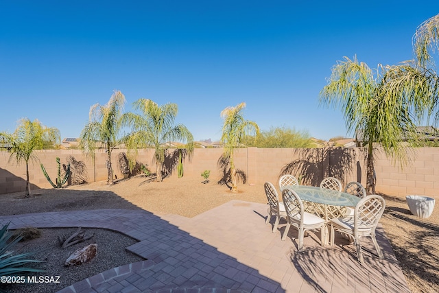 view of patio / terrace with outdoor dining area and a fenced backyard