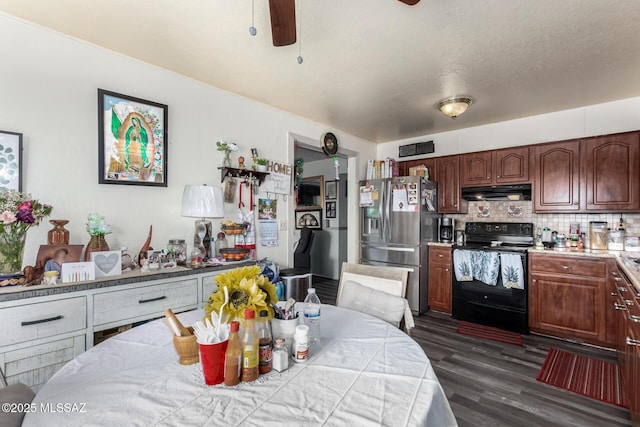 kitchen with under cabinet range hood, dark wood-type flooring, decorative backsplash, black electric range oven, and stainless steel fridge