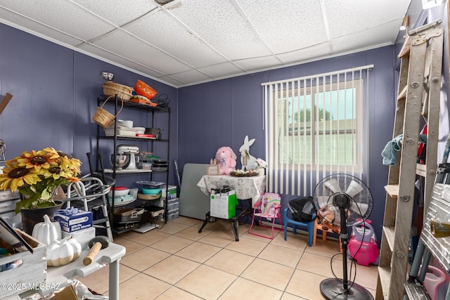 playroom with tile patterned flooring and a drop ceiling