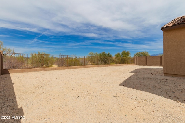 view of yard with a fenced backyard