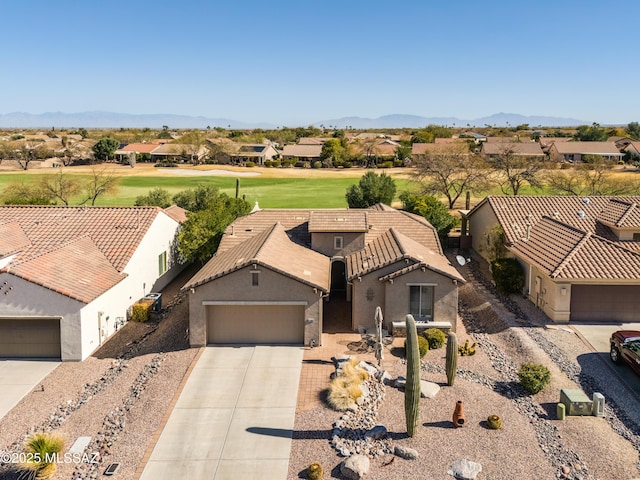 birds eye view of property featuring a mountain view