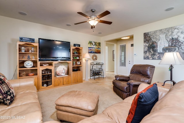 living area with ceiling fan