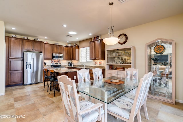 dining room featuring recessed lighting, visible vents, and baseboards