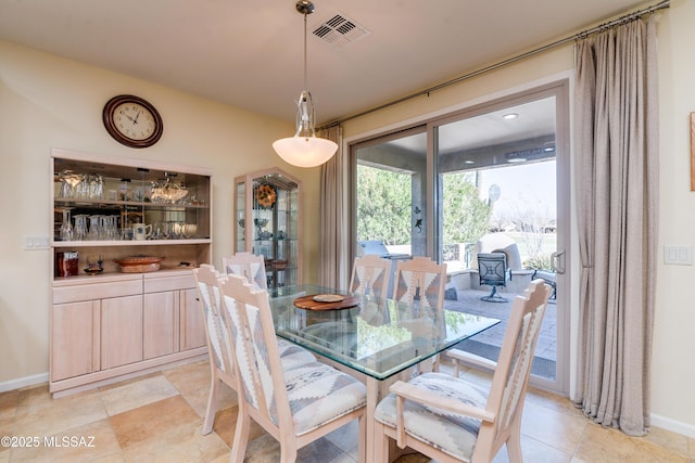 dining area with visible vents and baseboards