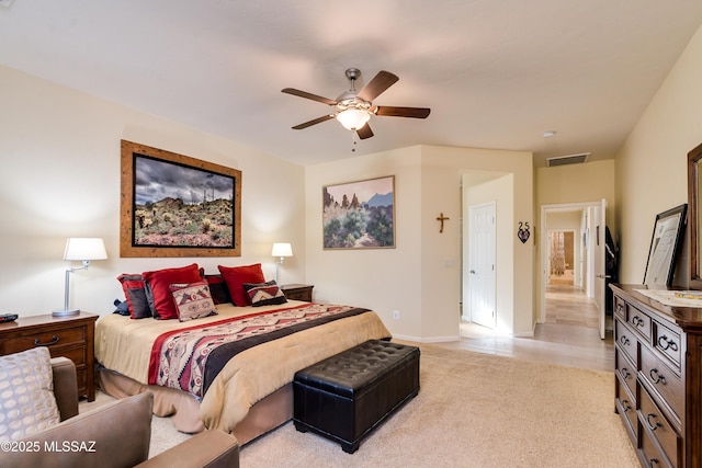 bedroom featuring light carpet, ceiling fan, visible vents, and baseboards