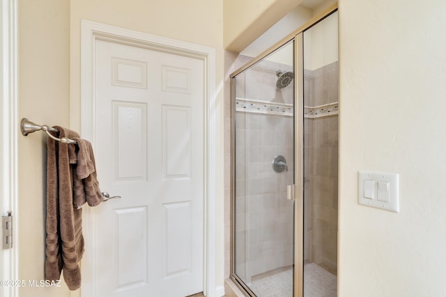 full bathroom with a shower stall