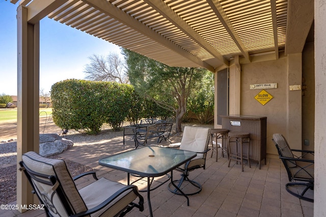 view of patio featuring outdoor dining space and a pergola