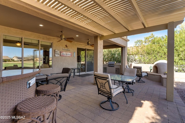 view of patio with area for grilling, a grill, a ceiling fan, a pergola, and outdoor dining space