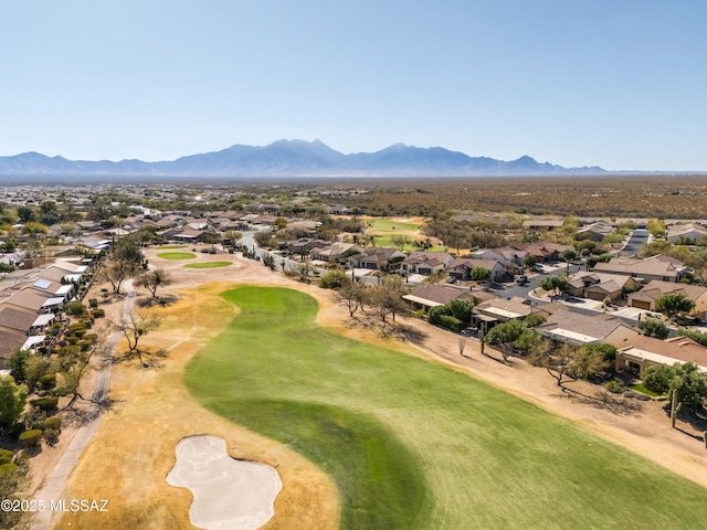 drone / aerial view featuring a residential view, a mountain view, and golf course view