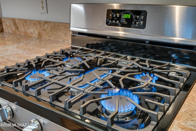 room details with stainless steel gas stove