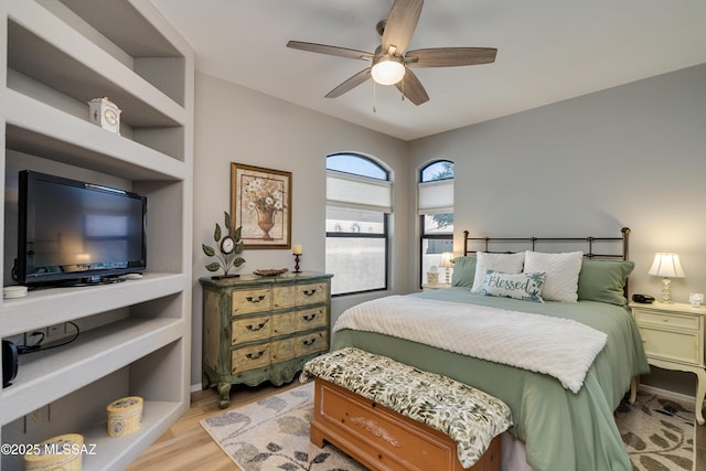 bedroom with light wood-style floors and ceiling fan