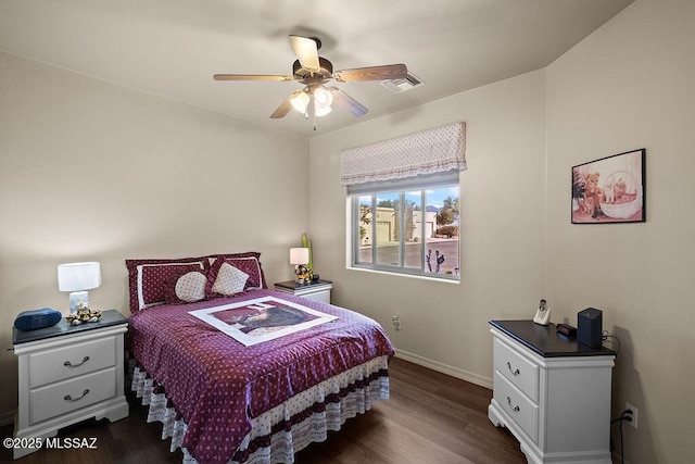 bedroom with ceiling fan, baseboards, dark wood-style flooring, and visible vents